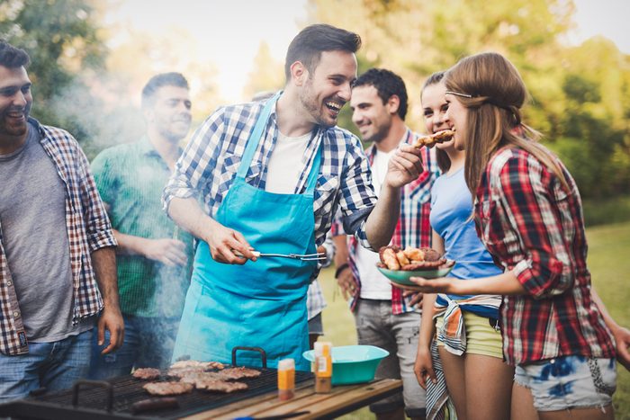 Friends having a barbecue party in nature while having a blast; Shutterstock ID 607634918; Job (TFH, TOH, RD, BNB, CWM, CM): TOH