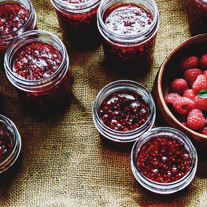 Canning raspberry jam.