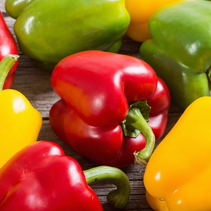 Colorful green , red and yellow peppers paprika background