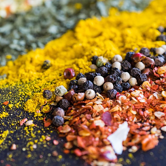 Spices and herbs on a black background; Shutterstock ID 545932456