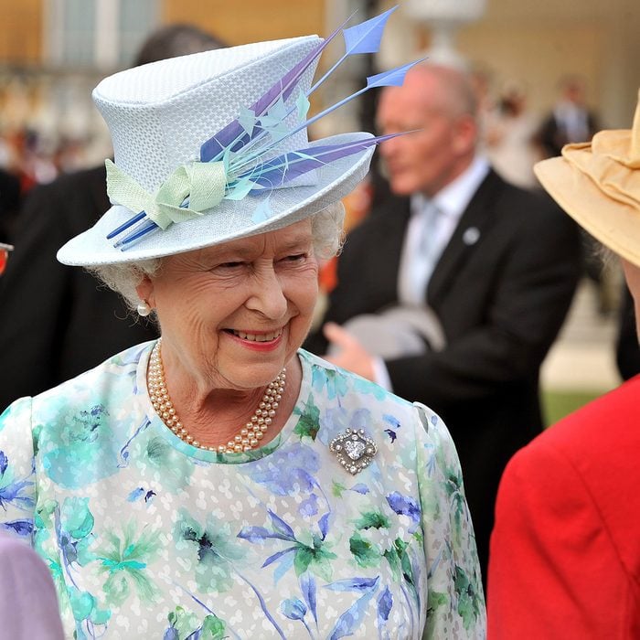 Queen Elizabeth II talks to guests Garden Party at Buckingham Palace, London, Britain