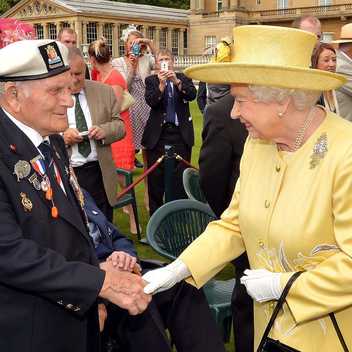 Queen Elizabeth II talks to a veteran Not Forgotten garden party at Buckingham Palace, London, Britain 