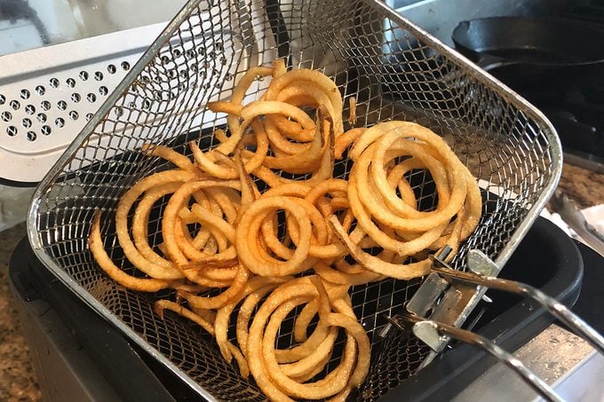 Fries coming out of the fryer