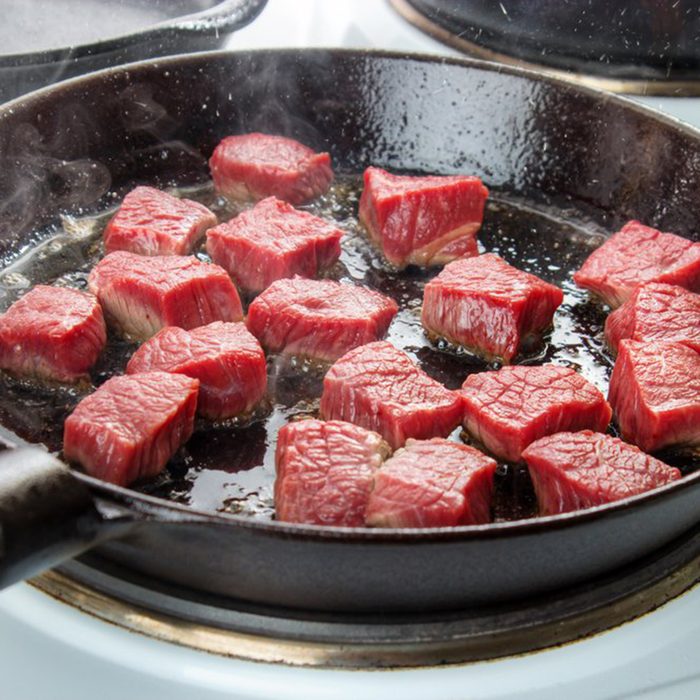 Meat cooking in a skillet