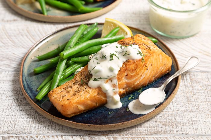 Fully prepared Pan Seared Salmon With Dill Sauce served in a plate