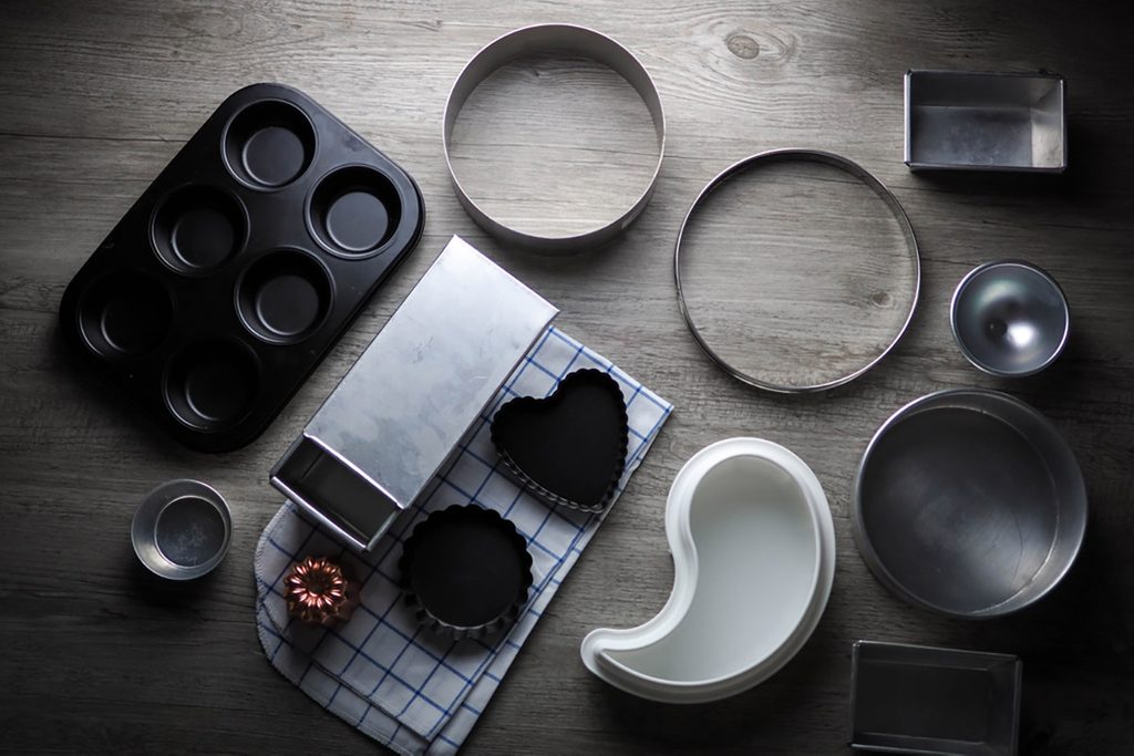 Bakeware (bakery tools) on wood table.