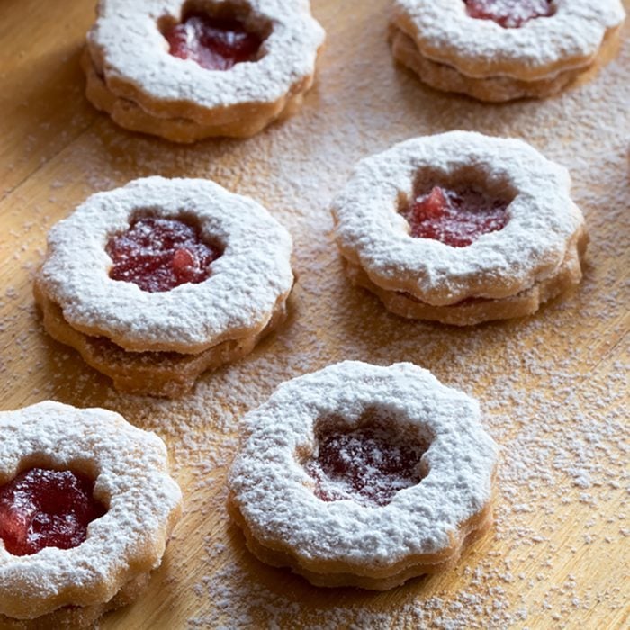 Trraditional Linzer Christmas cookies filled with marmalade and dusted with sugar