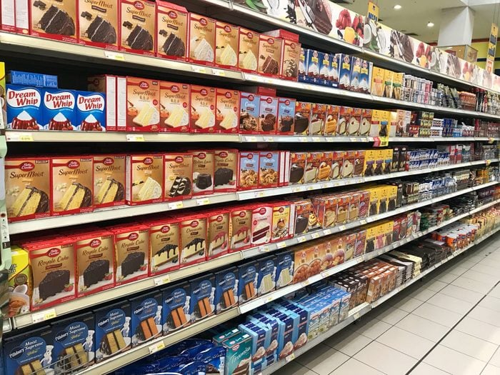 KUWAIT CITY, KUWAIT - April 25, 2017 : Various brands of cake mixture that lined up on shelves in the market. Baking cake for preparation of having it on Eid Mubarak.