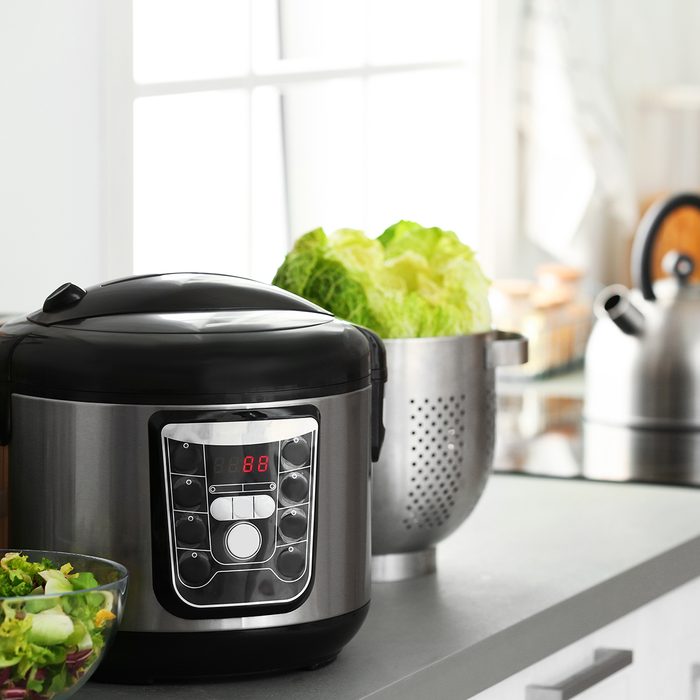 Modern electric multi cooker and food on kitchen countertop. Space for text; Shutterstock ID 1304469877; Job (TFH, TOH, RD, BNB, CWM, CM): Taste of Home