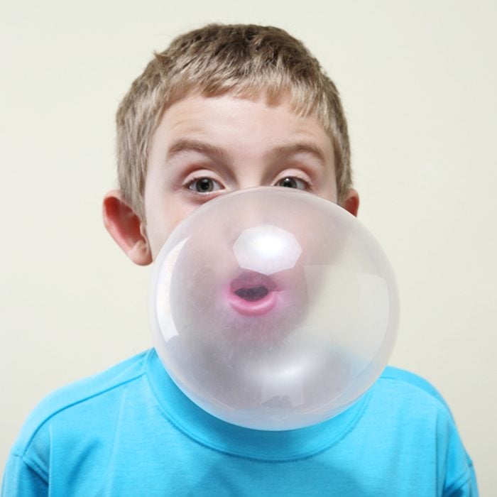 Boy blowing a bubble