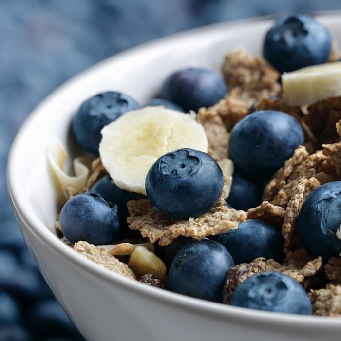 Healthy breakfast with high fibre bran flakes, blueberry and banana