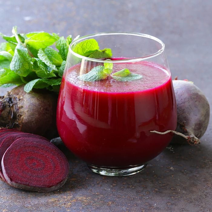 fresh beet juice with mint leaf in a glass