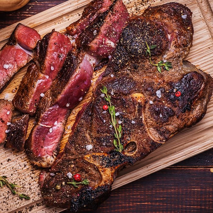 Beef steak on a wooden background