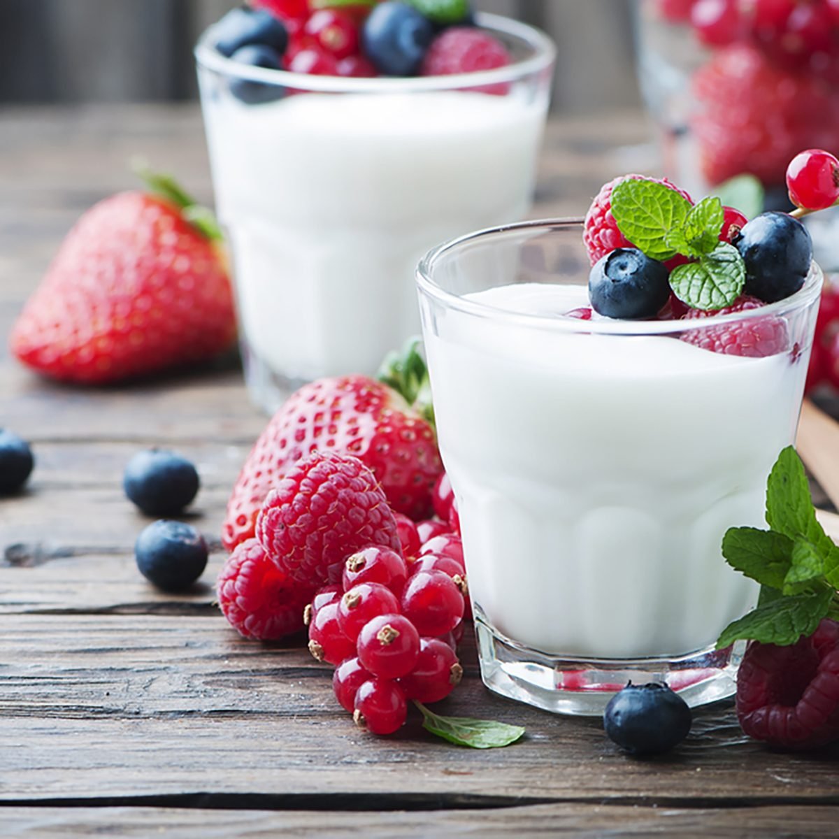 Healthy yogurt with mix of berry, selective focus