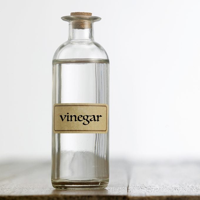 white vinegar on the wooden table top