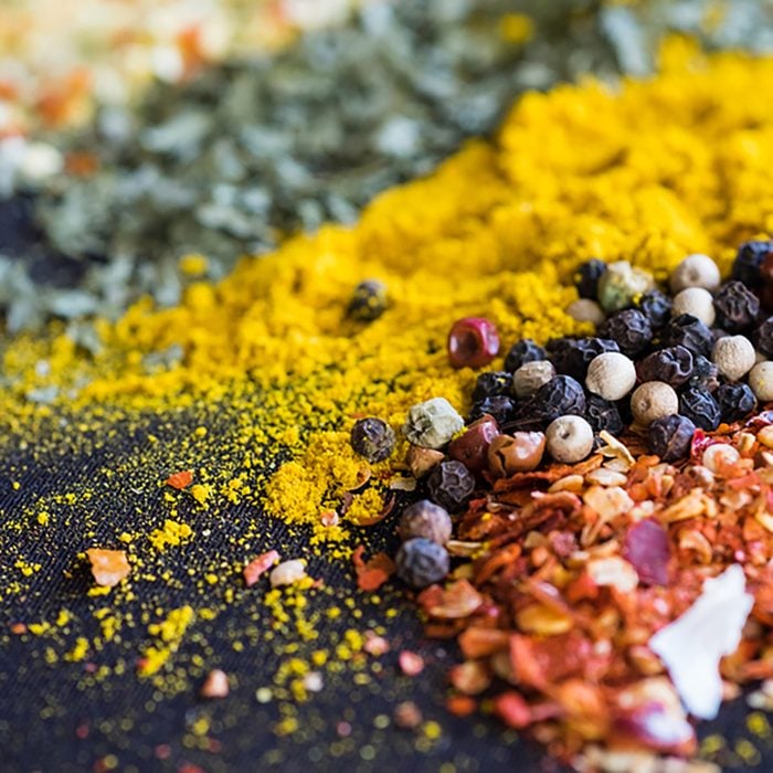 Spices and herbs on a black background