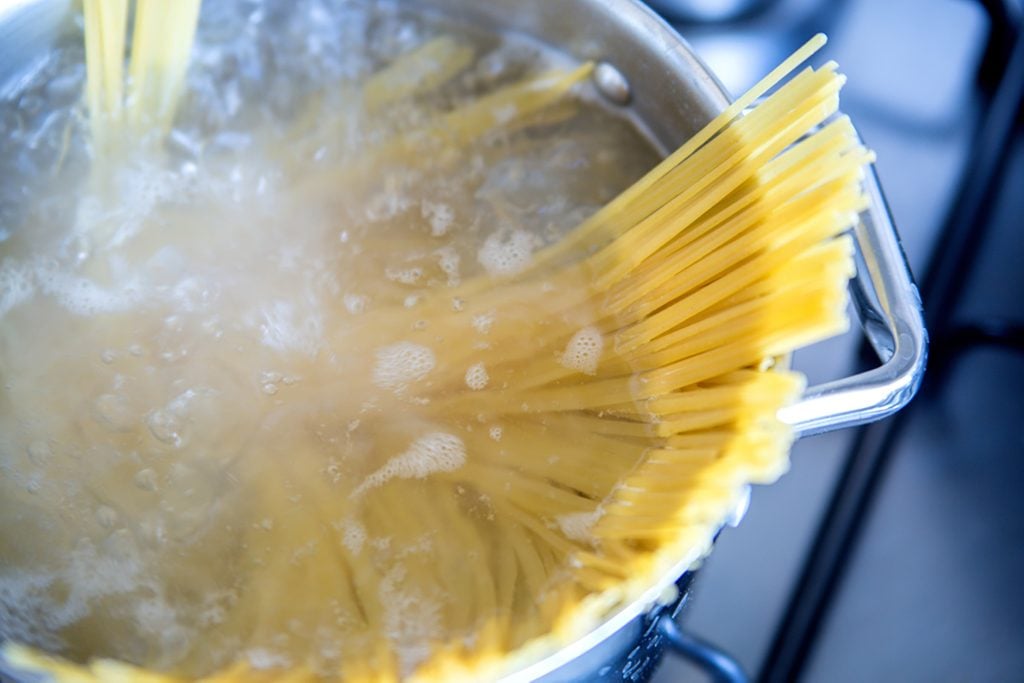 Boiling spaghetti in a stainless steel pot