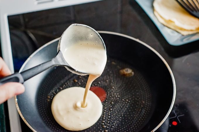 Making of home made pancakes. Close up view; Shutterstock ID 584348617