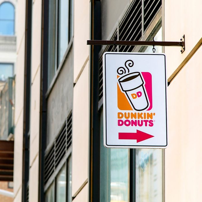 A sign over an entrance to a Dunkin Donuts location in Manhattan
