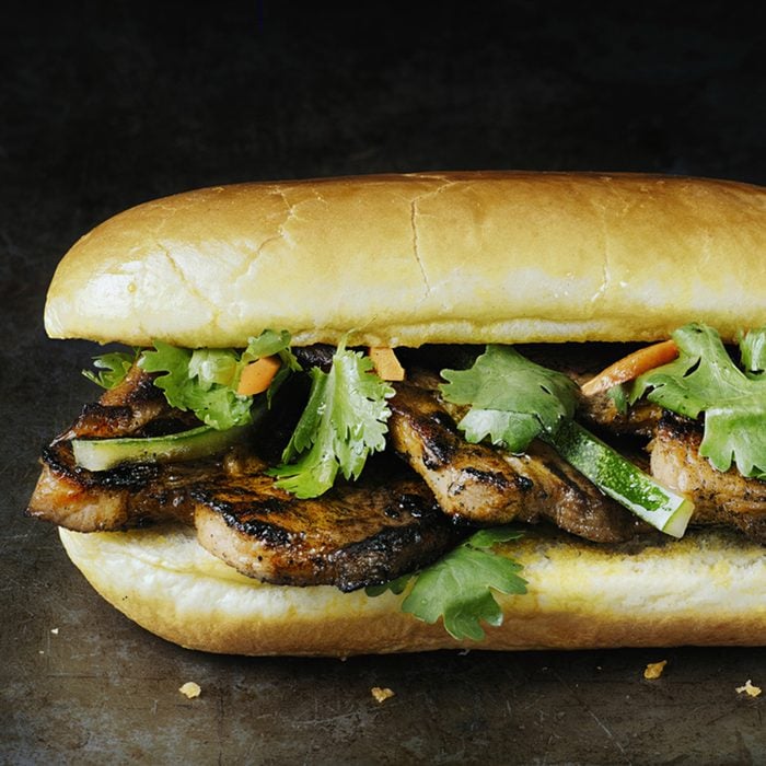 close up of rustic vietnamese bahn mi pork sandwich