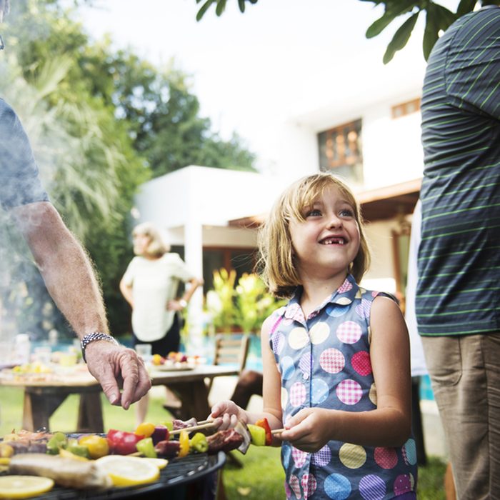 Diverse people enjoying barbecue party together