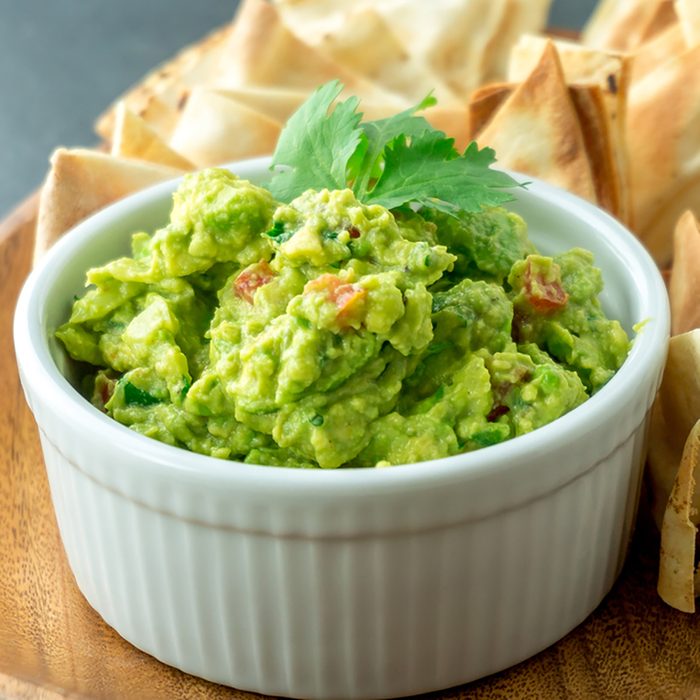 Fresh guacamole bowl. Guacamole is a avocado based dip, traditionally a mexican (Aztecs) dish. Healthy and easy to make at home with a few simple ingredients.