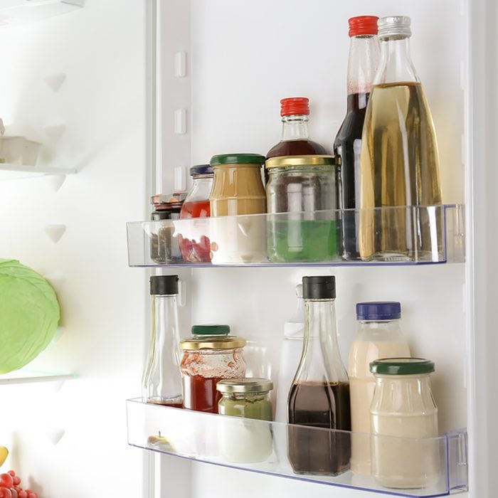 Different sauces on shelves in fridge; Shutterstock ID 697604257; Job (TFH, TOH, RD, BNB, CWM, CM): Taste of Home