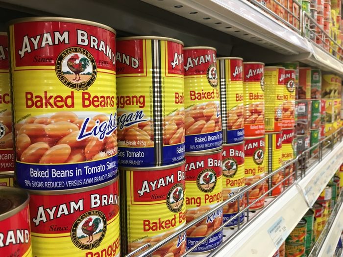 RAWANG, MALAYSIA - SEPTEMBER 15, 2017 : Row of Ayam (Chicken) Brand Baked Beans cans display on the shelf at hypermarket. Ayam Brand believes only in quality ingredients prepared naturally.