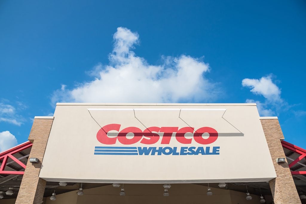 Close-up facade and logo of Costco storefront. Costco Wholesale Corporation is largest membership-only warehouse club in US.