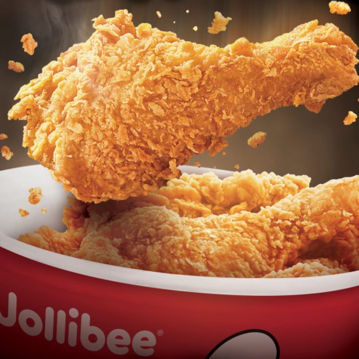 Fried chicken falling into a bucket