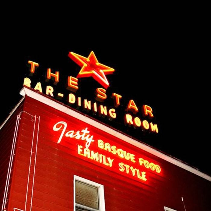Glowing sign outside for The Star Hotel