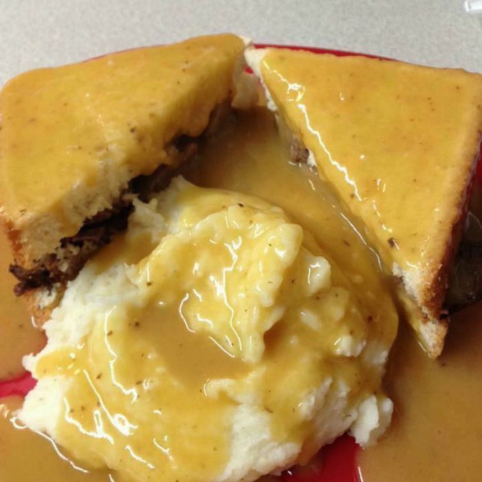 Mashed potatoes and thick cuts of bread on a plate