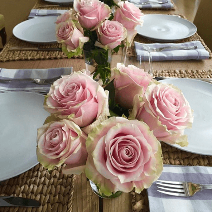 Table with rose centerpieces