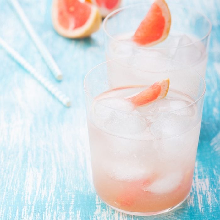 Juicy grapefruit cocktail with ice and alcohol