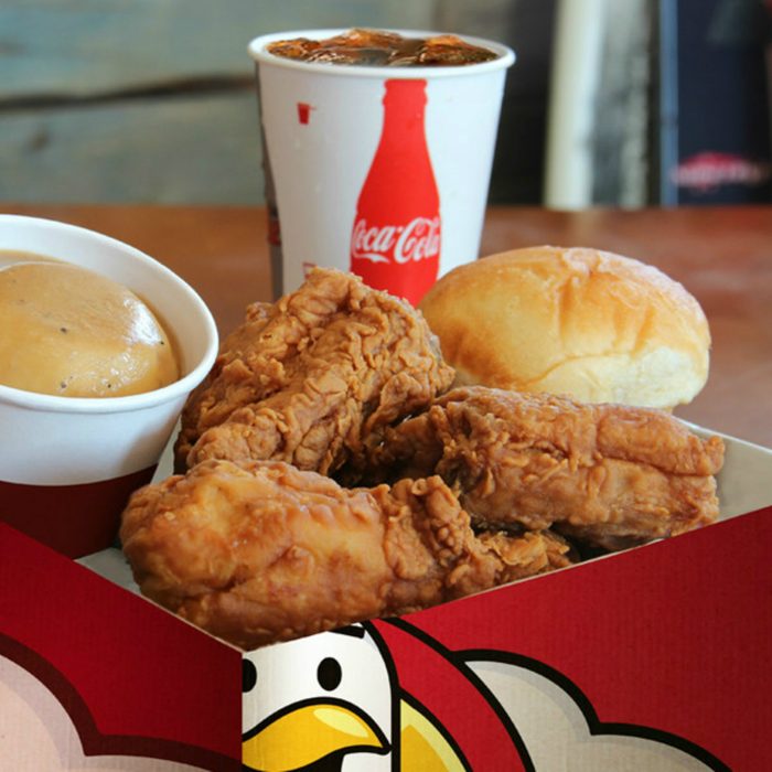 Heaven Sent Fried Chicken with a roll, sauce and drink