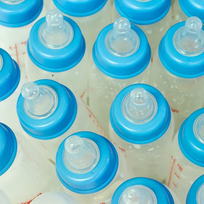 baby formula in bottles with blue caps