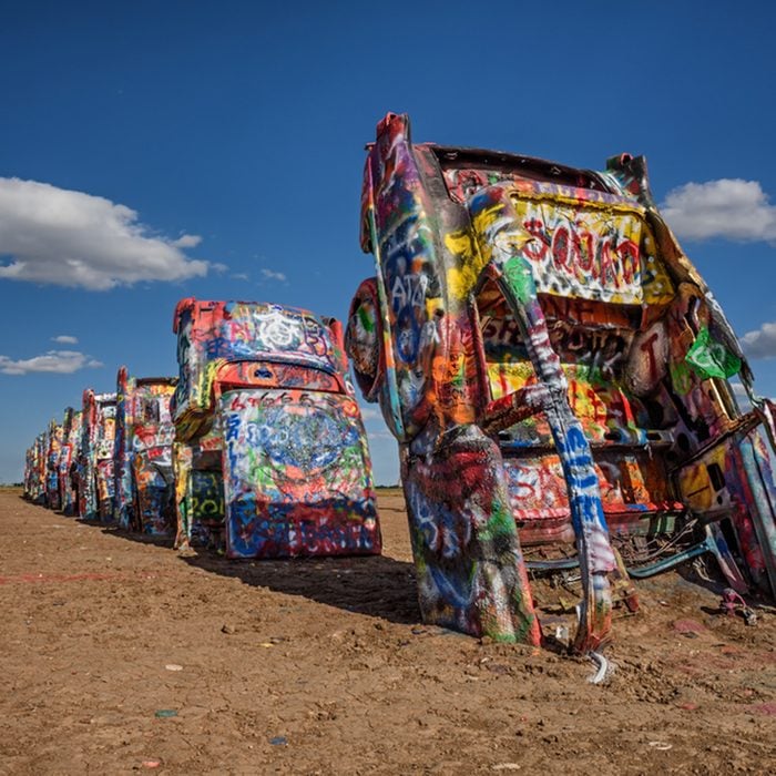 AMARILLO, TEXAS, USA - MAY 12, 2016 : Cadillac Ranch in Amarillo. Cadillac Ranch is a public art installation of old car wrecks and a popular landmark on historic Route 66; Shutterstock ID 477078388; Job (TFH, TOH, RD, BNB, CWM, CM): TOH