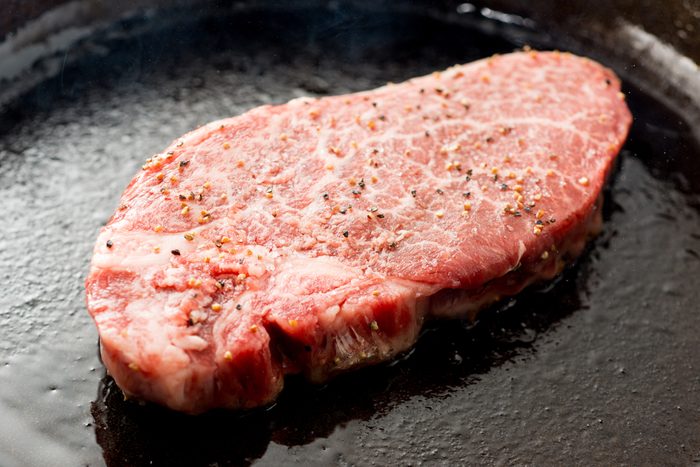 Japanese steak on cast-iron skillet; Shutterstock ID 713192269; Job (TFH, TOH, RD, BNB, CWM, CM): TOH Cast Iron Steak on the Grill