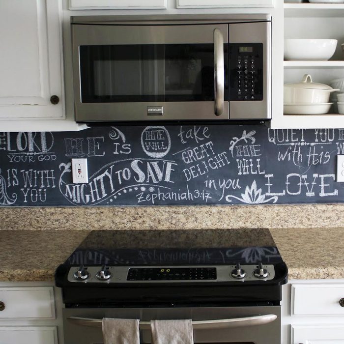 Kitchen featuring a chic chalkboard backsplash