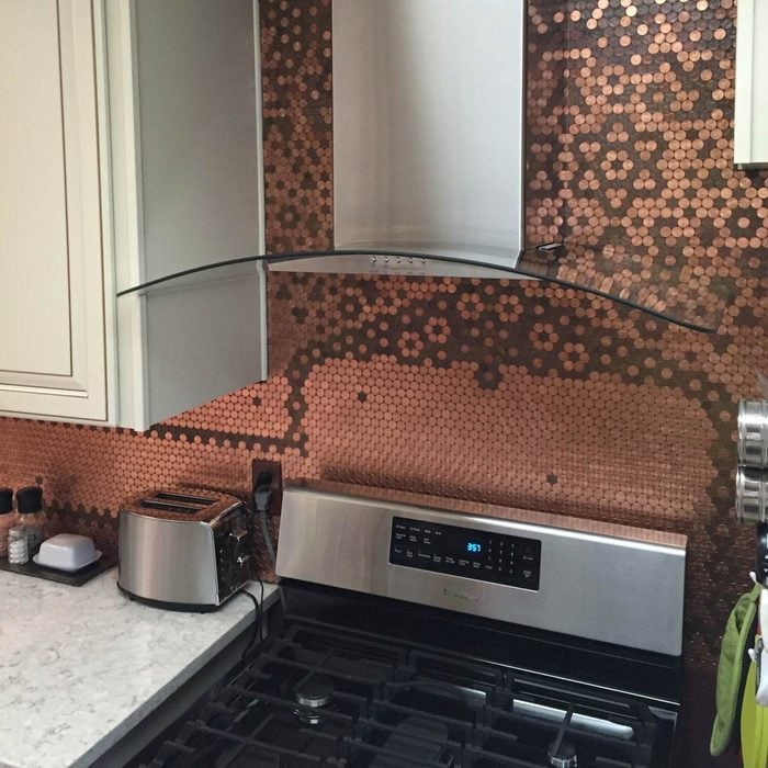 Kitchen with pennies decorating its backsplash