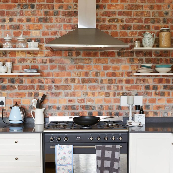 Kitchen with brick backsplash