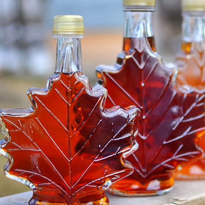 bottles of maple syrup in leaf-shaped bottles