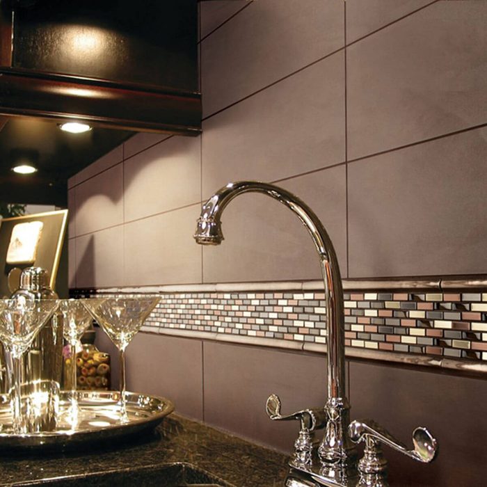 Kitchen with elegant mix and matched tile backsplash