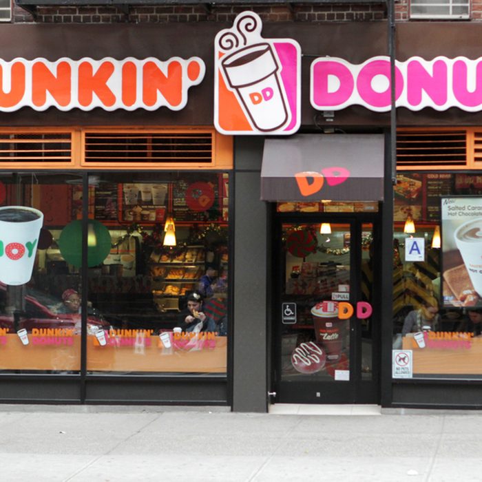 An exterior view of a Dunkin Donuts coffee shop in New York City