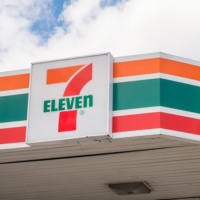 7/11 store logo against cloud sky background