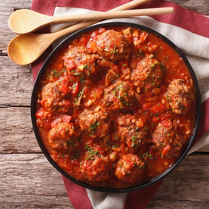 Meatballs with spicy tomato sauce on a plate.