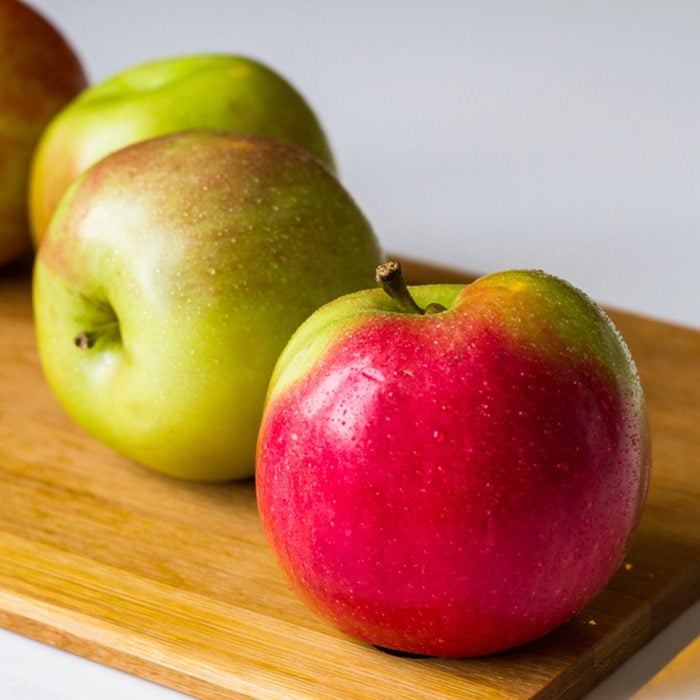 Idared Fresh apples on a cutting board.