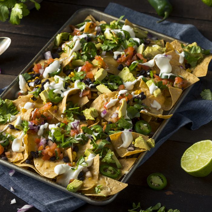Homemade Loaded Sheet Pan Nachos with Cilantro Lime Tomato and Onion