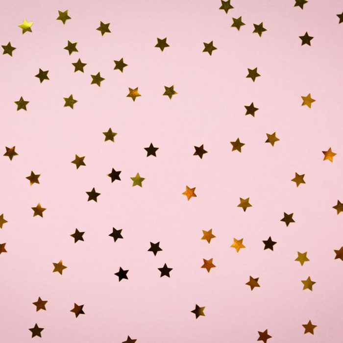 Golden star sprinkles on pink.