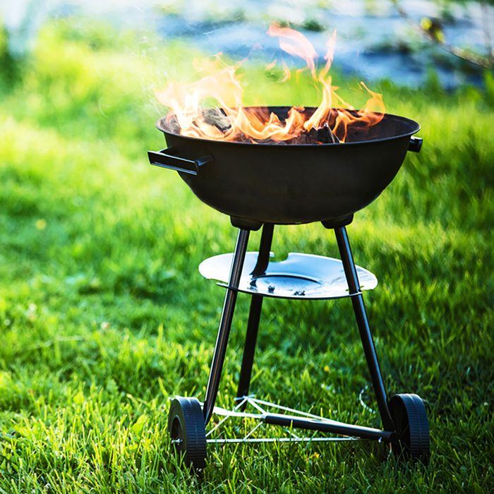 Barbecue grill with fire on nature,